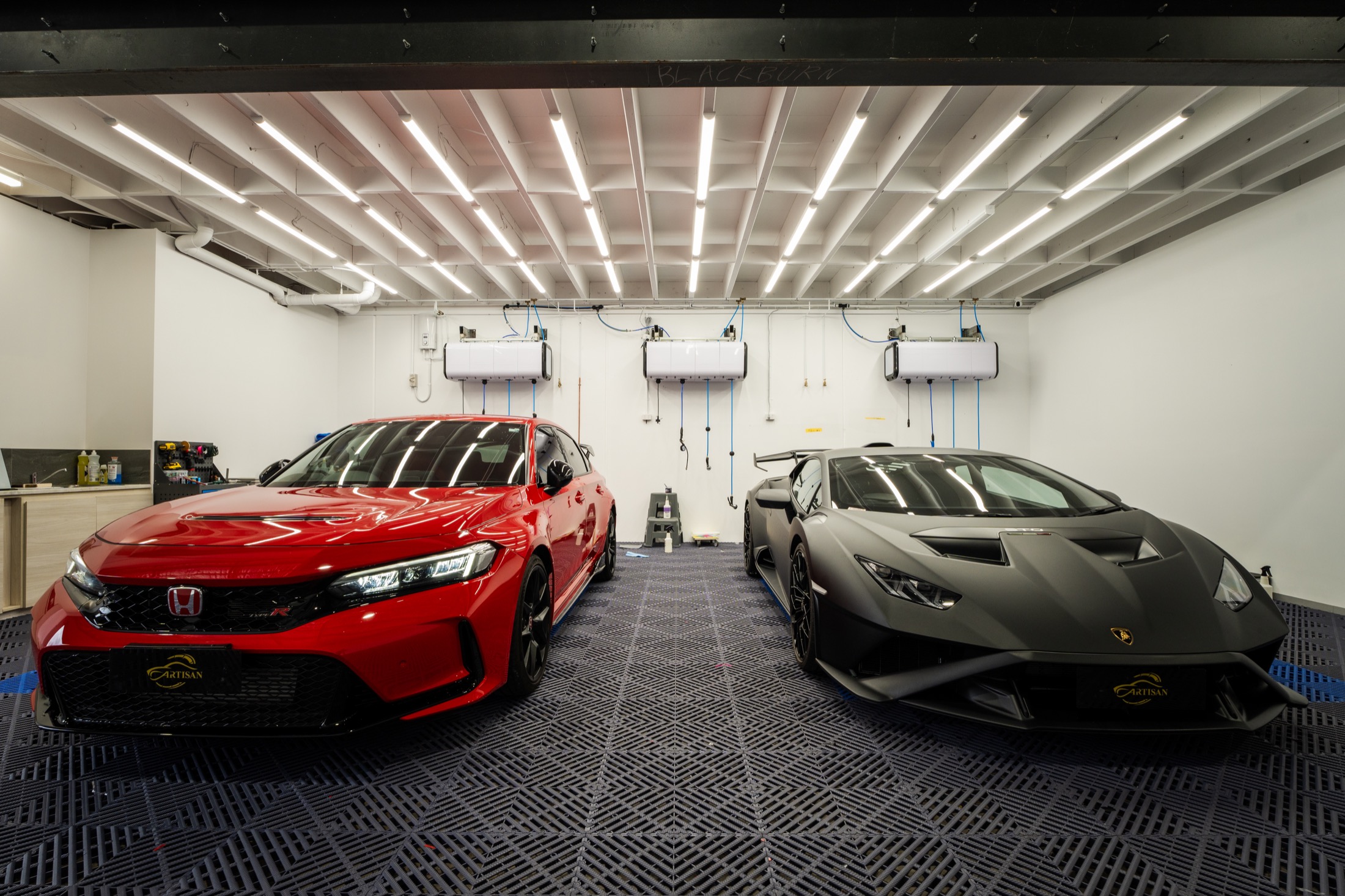 New vehicles prepared inside the Artisan Blackburn installation studio