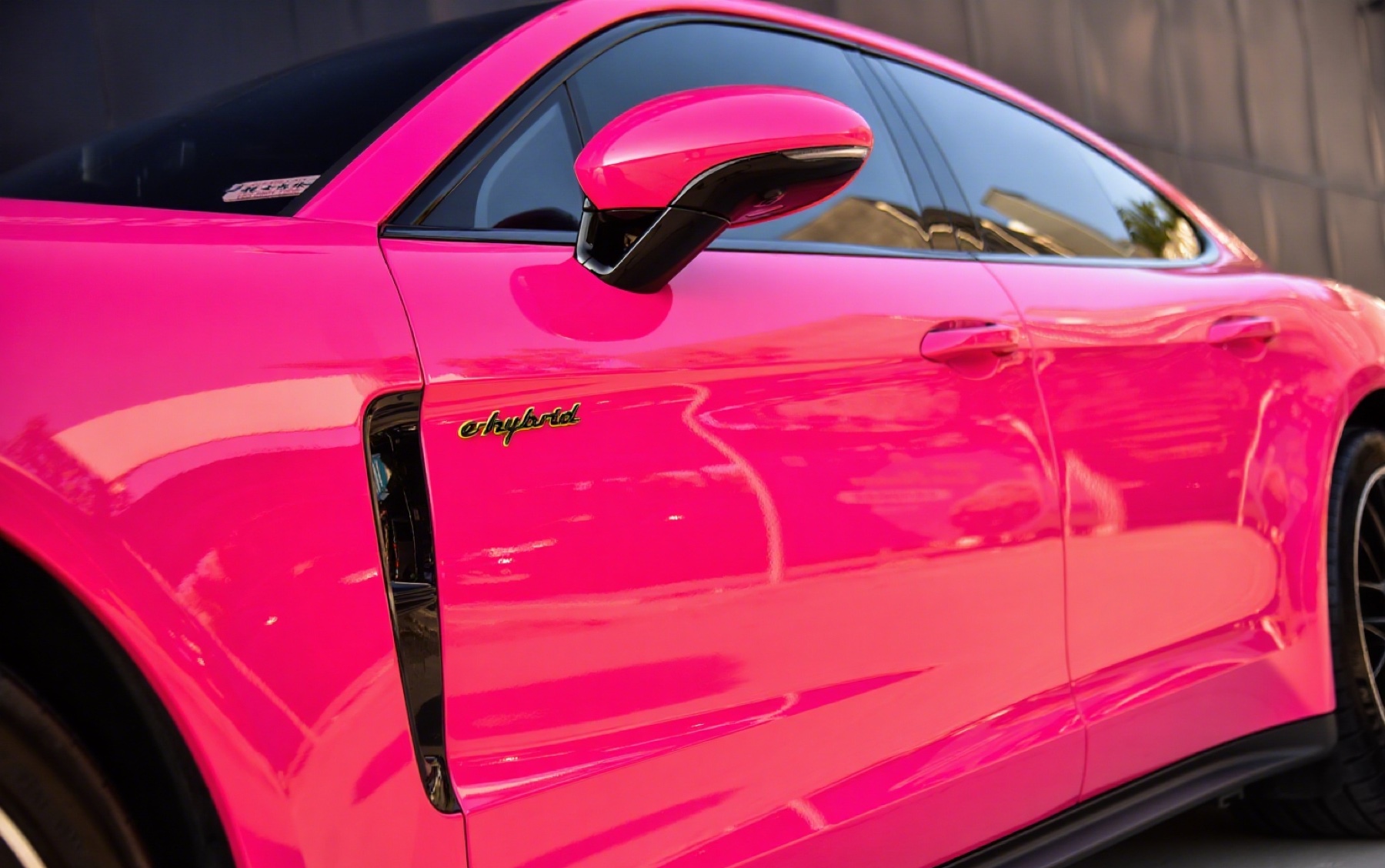 Close-up of a vivid pink Porsche colour-change finish